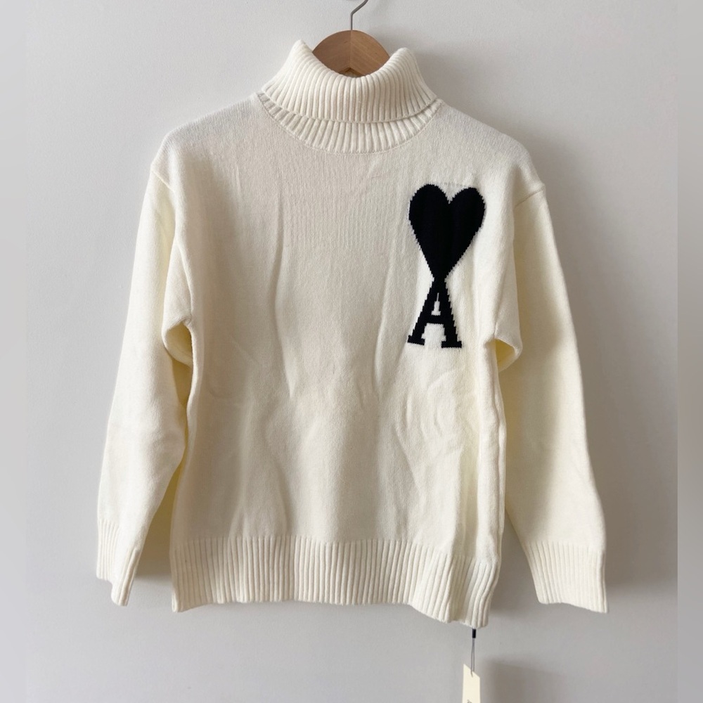 Designer Inspired Cream Turtleneck Sweater with Black Heart Accent